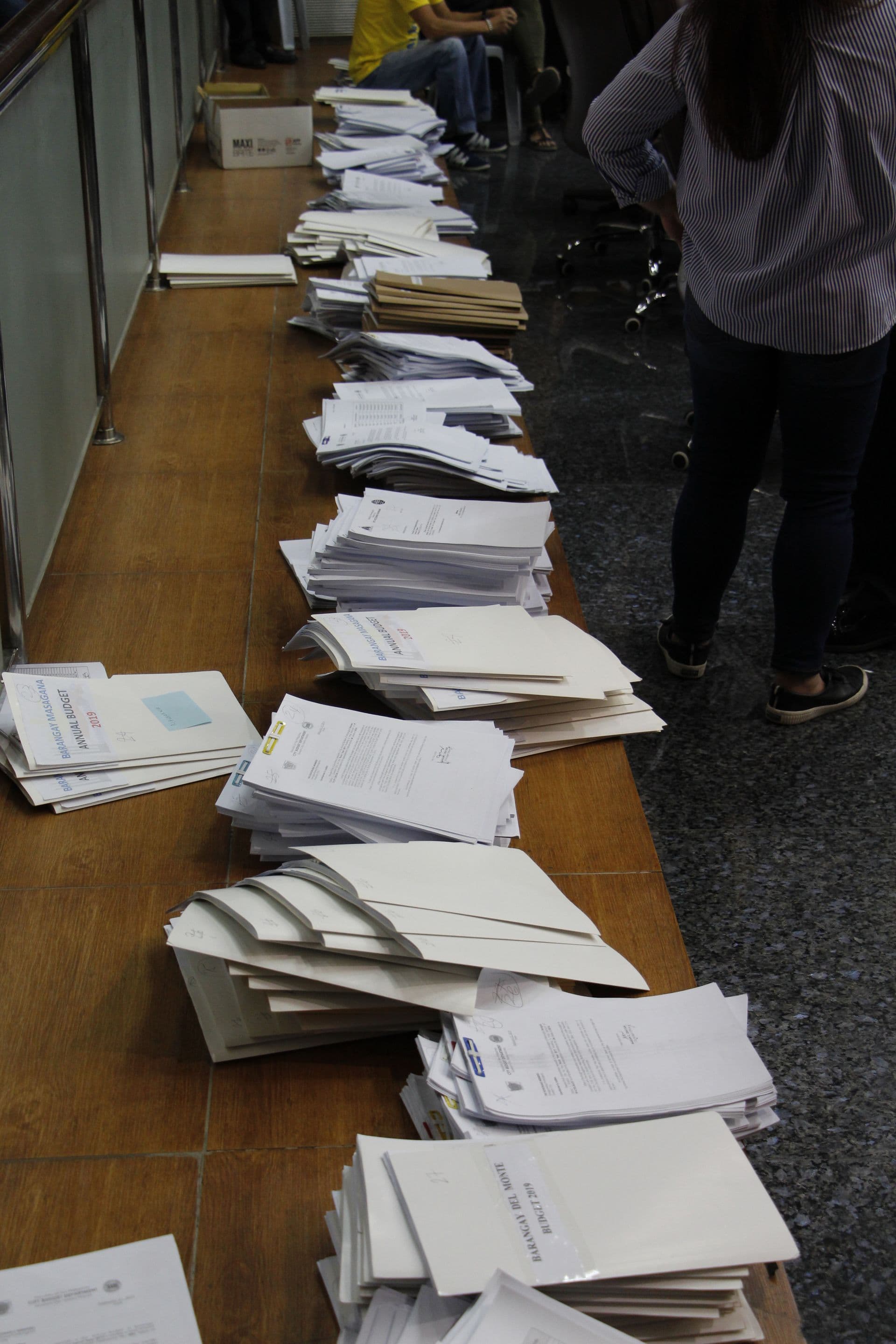 Shipping documentation being checked at a desk