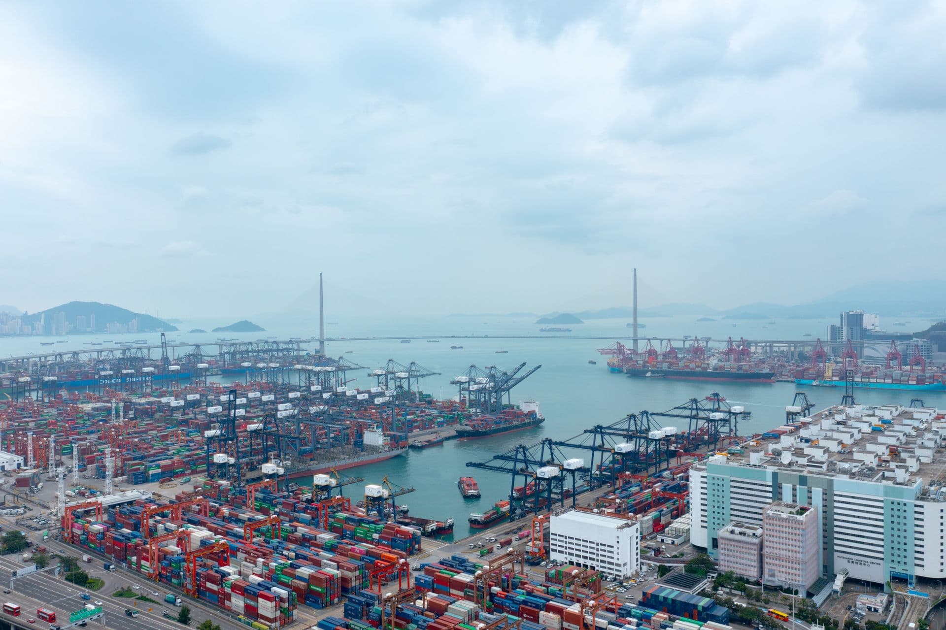 Container port photographed from above, cranes along the quay